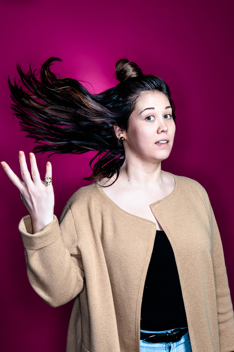 portrait of Chelsie Wyse of TACt Marketing doing a hair flip