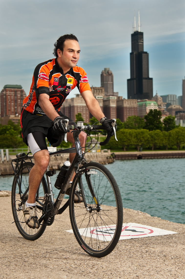 Man riding bike by Shedd Aquarium in Chicago