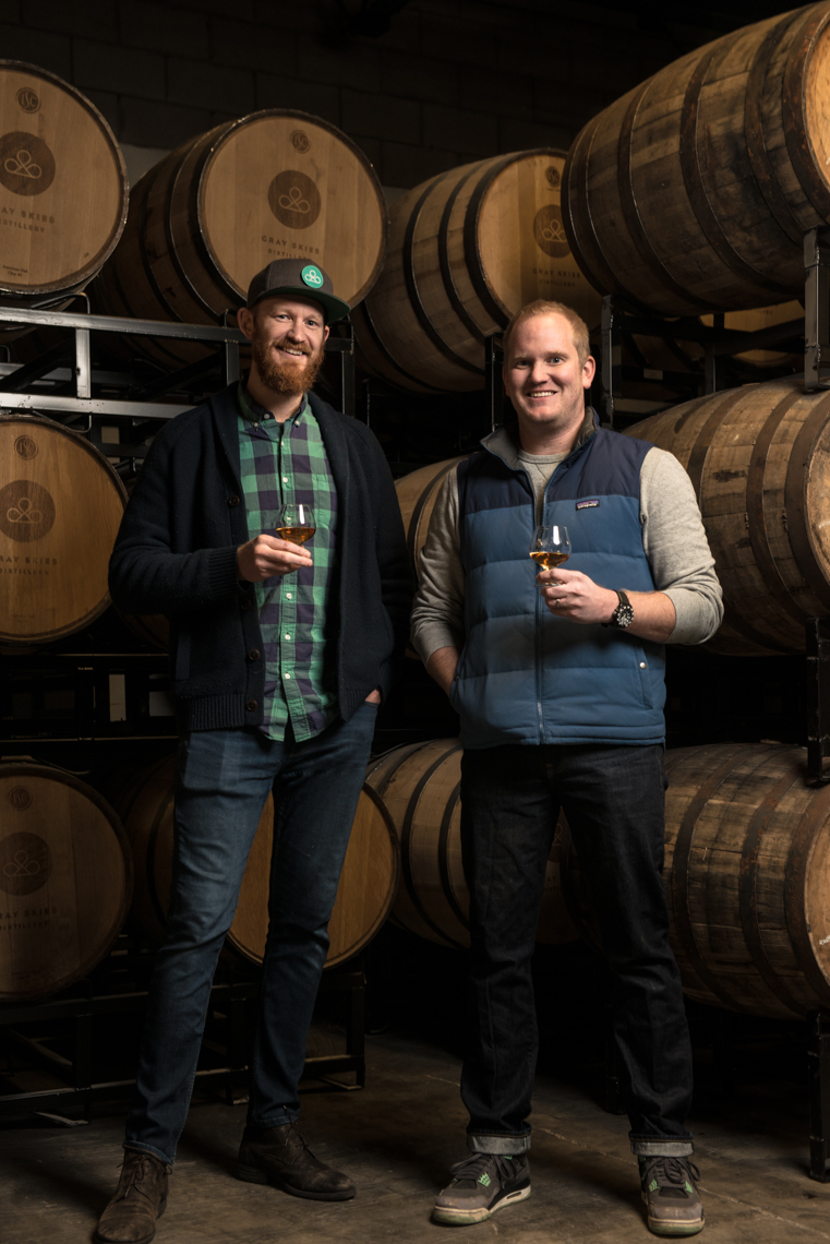 the owners of Eastern Kille Distillery in the barrel room