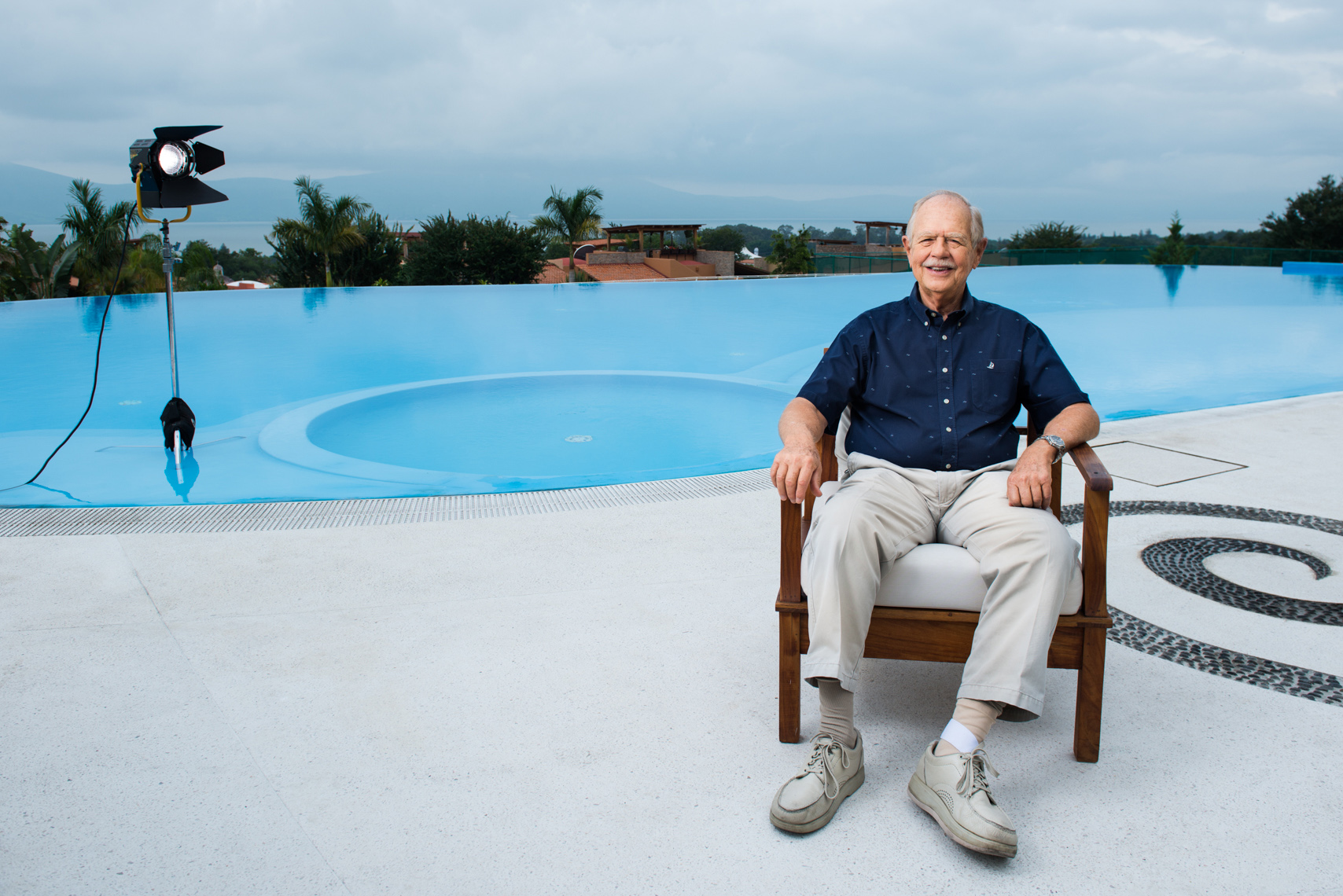 older gentleman sitting poolside in Jalisco, Mexico